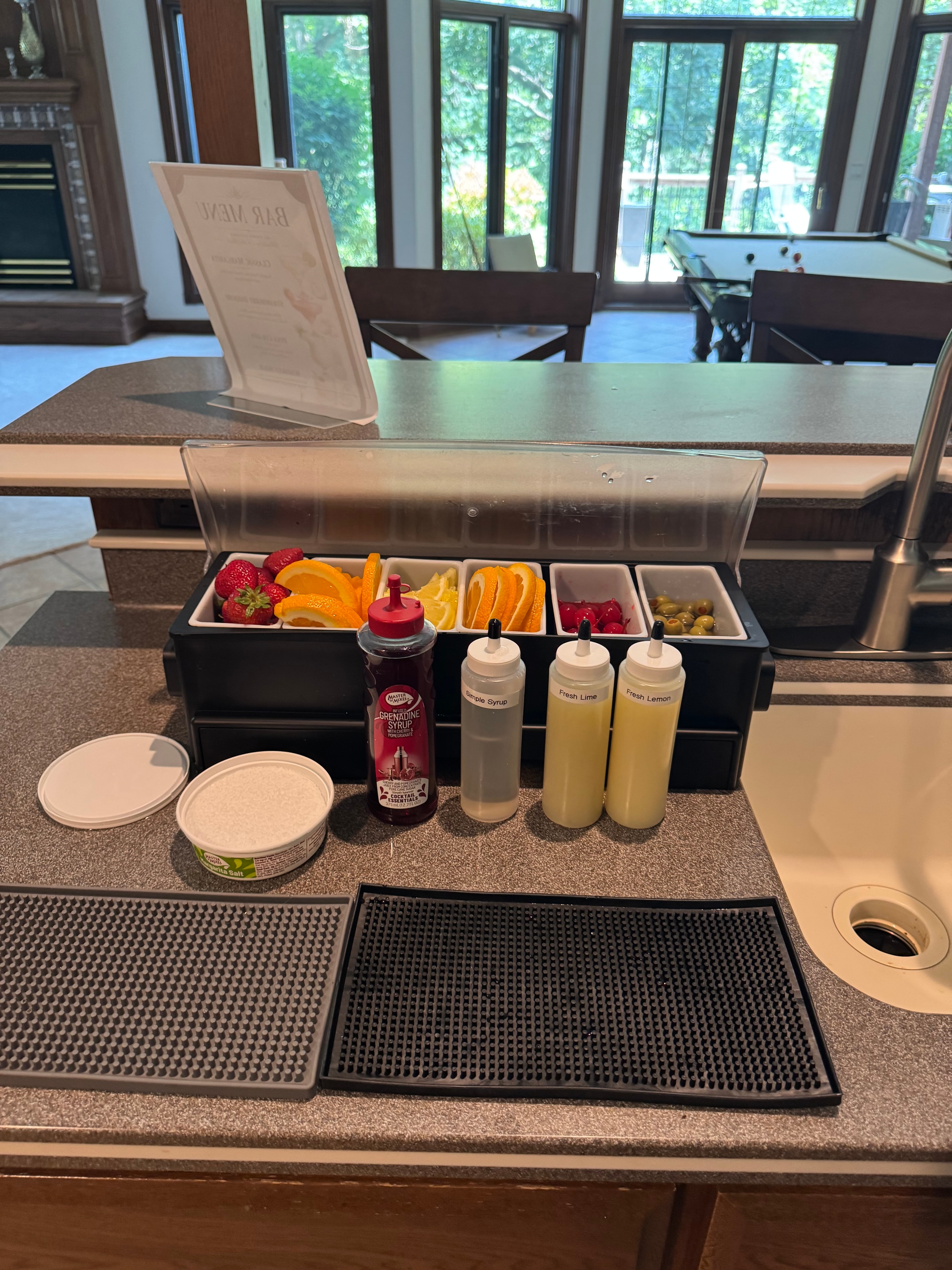Wide view of the Burlington home bar setup with pool table in background